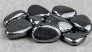 Shiny metallic stones on gray surface