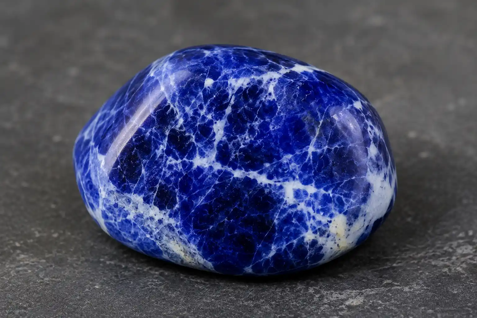 a deep blue stone with white calcite veins