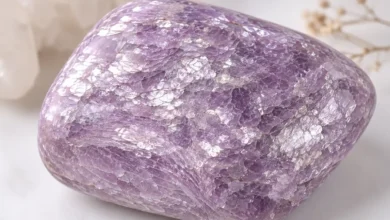 a shimmering lilac lepidolite stone with layered mica texture
