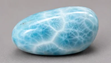 a sky-blue larimar stone with white wave-like patterning