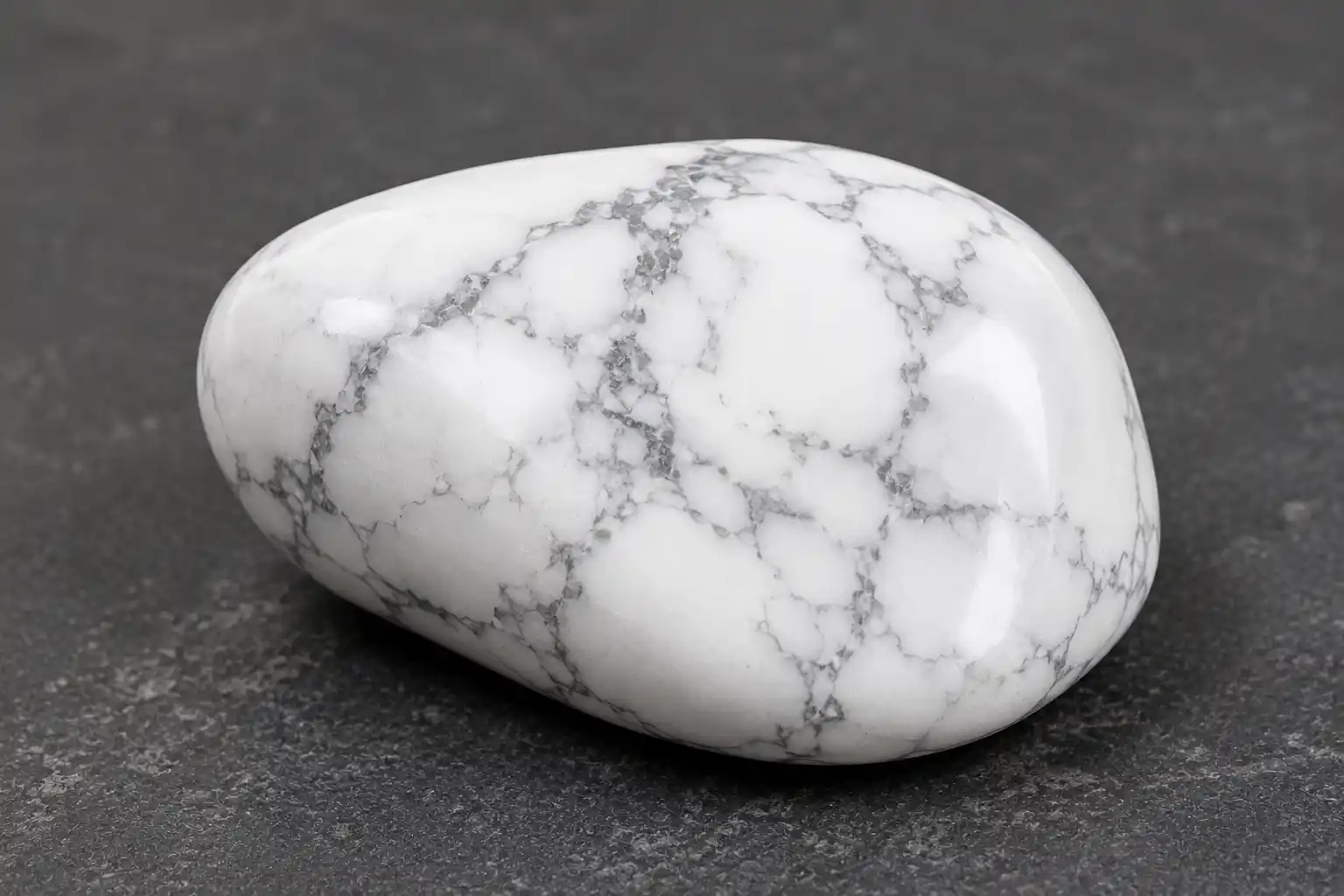 a white howlite stone with grey web-like veining