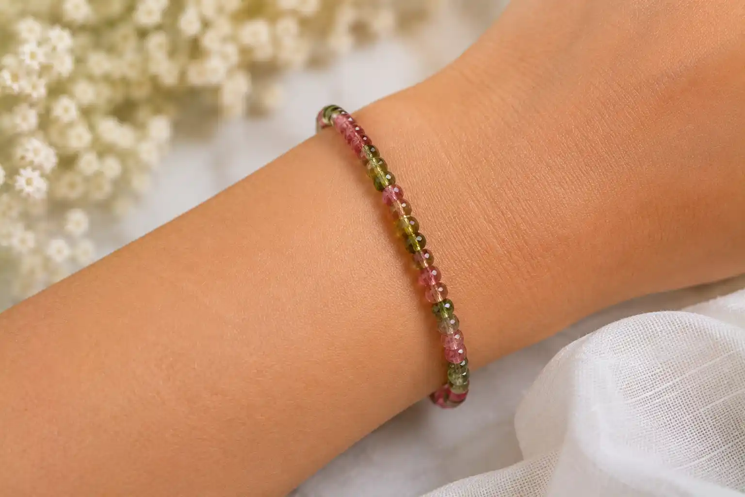Delicate bracelet with soft floral backdrop