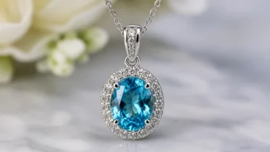 blue zircon pendant necklace on a fine chain catching the light