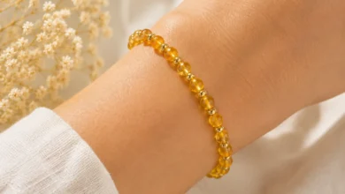 a golden citrine bead bracelet on a wrist