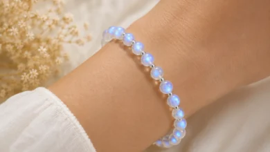 a moonstone bead bracelet glowing on a wrist