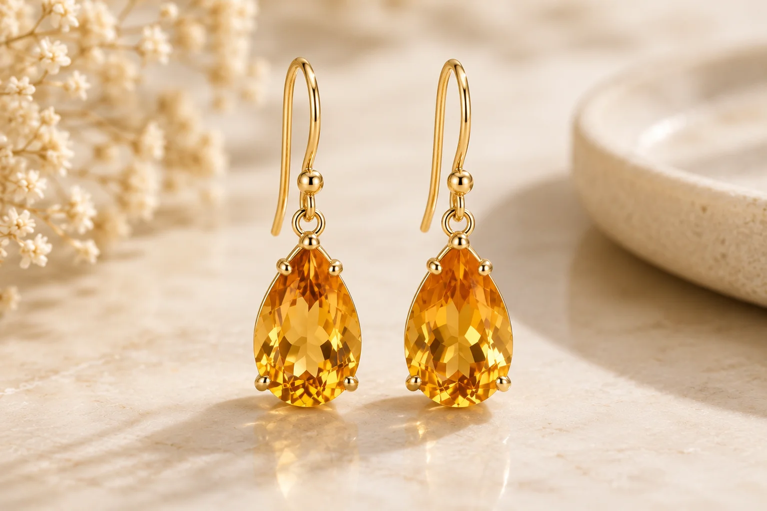 a pair of golden citrine drop earrings