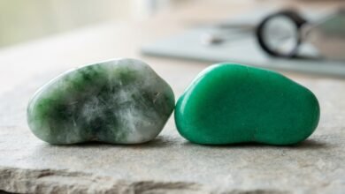 natural green jade beside a dyed jade imitation