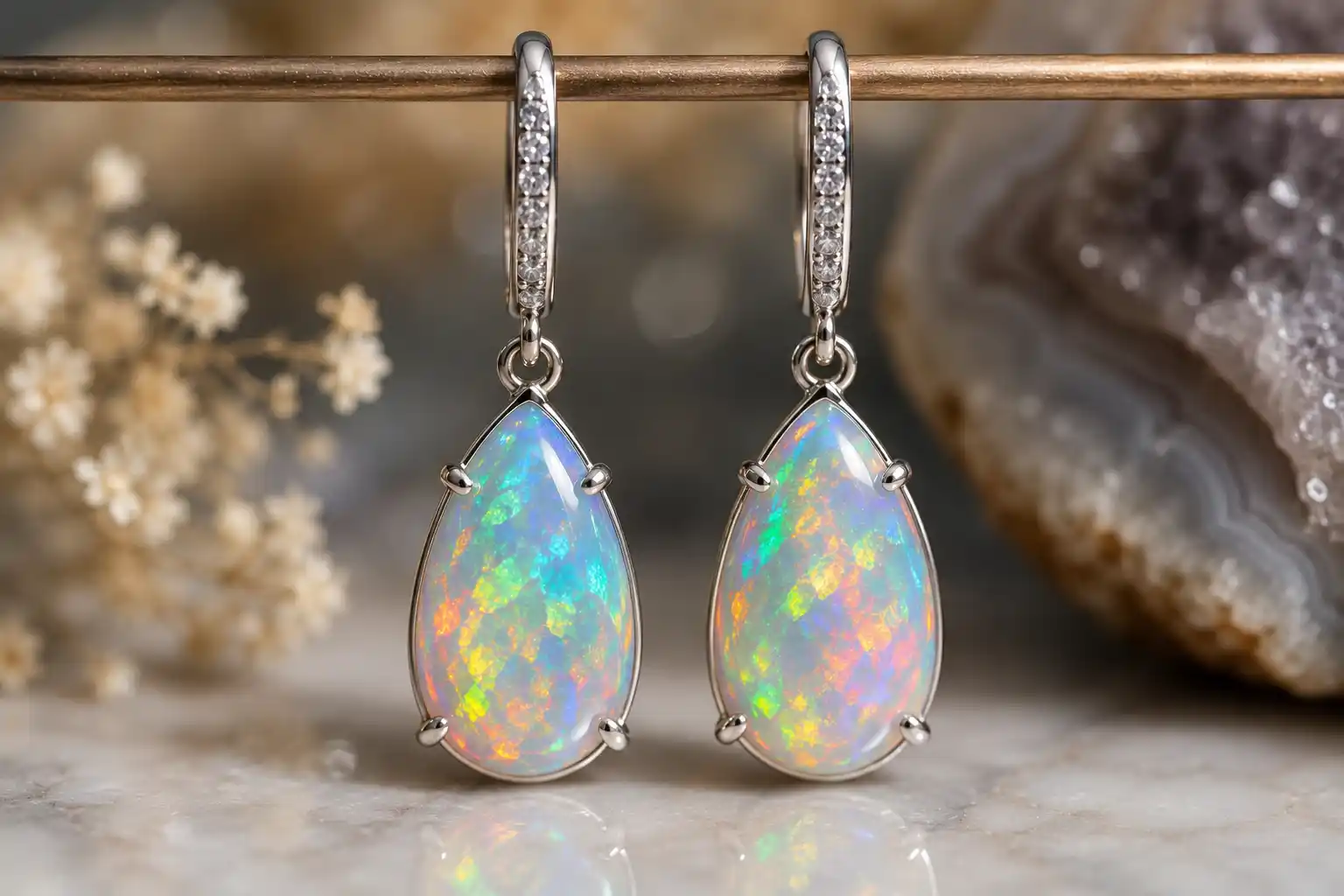 pair of opal drop earrings flashing color