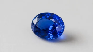 photo of a blue sapphire on a plain surface
