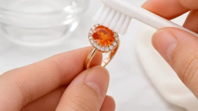 photo of a spessartite ring being cleaned with a soft brush