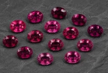photo of loose rhodolite garnets in several tones