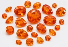 photo of loose spessartite garnets in orange tones