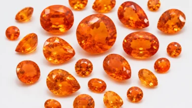 photo of loose spessartite garnets in orange tones