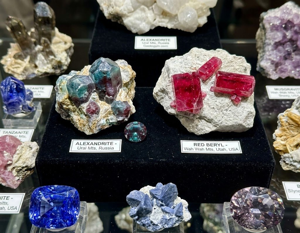 rare gemstone specimens including alexandrite and red beryl