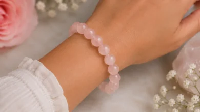 rose quartz bead bracelet on a wrist